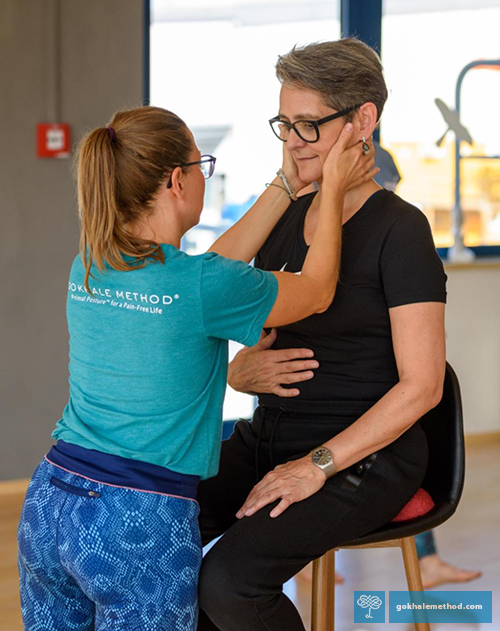 Gokhale Method Teacher Johanna Picker adjusting student’s head position.