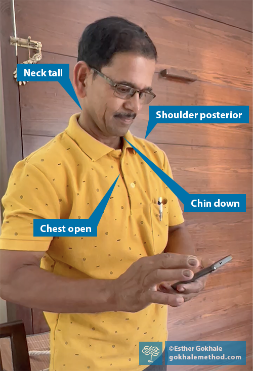Photo of Dyaneshwar using his cell phone.