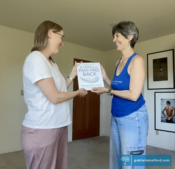 Esther and her student Sasha with 8 Steps to a Pain-Free Back, 2nd Edition.