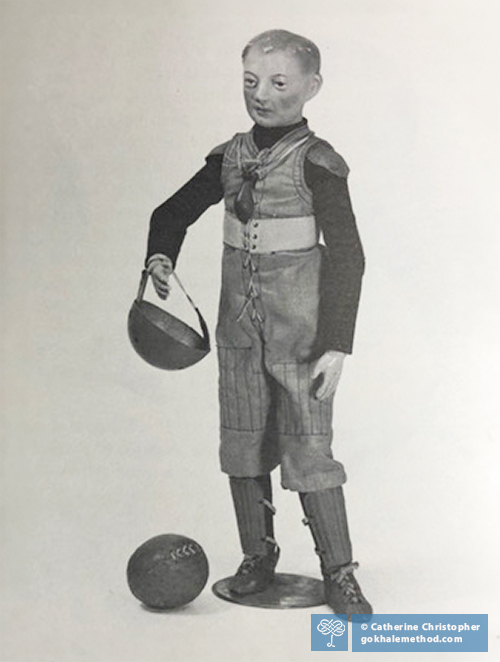 Antique American Schoenhut footballer doll, wood, clothed, from 1915.