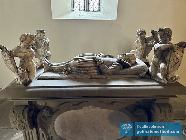 Antique tomb sculpture of reclined boy on sloping pillow, Öhringen church, Germany.