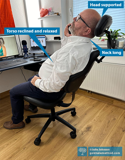 Photo of a man reclining at a desk in a Gokhale Executive chair.