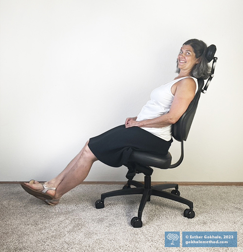 Esther Gokhale reclining in the Gokhale® Executive Chair, side view