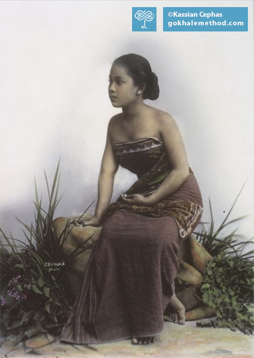 An Indonesian woman wearing the traditional kemben wrap-around costume, c. 1900. 