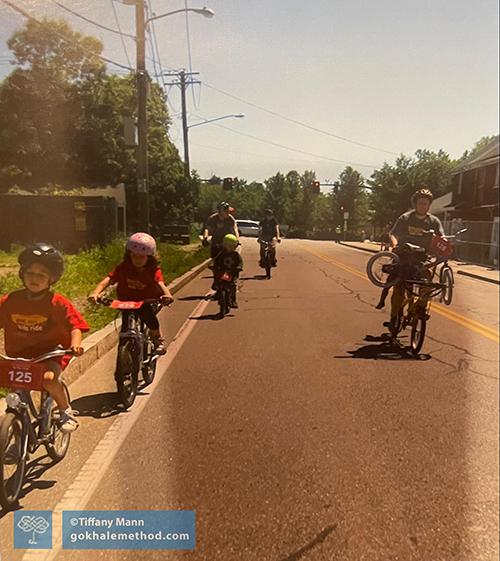 Adults and children cycling a 10k Pan Mass Challenge fundraiser.