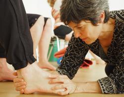 We pay a lot of attention to the feet in all our courses. Here I am showing a student how to kidney-bean shape their foot.
