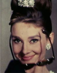 Audrey Hepburn knew how to use both her eyes and her sunglasses to good effect—and with strikingly good posture! (from Breakfast at Tiffany’s)