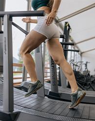 We get greater benefits and reduce potential down-sides when we use treadmills with healthy posture. She has her behind behind and leans forward.