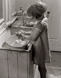 A young girl inclines slightly forward and lengthens the back of her neck to attend to her task. Her shoulders remain posterior, her chest open—no rounding over!